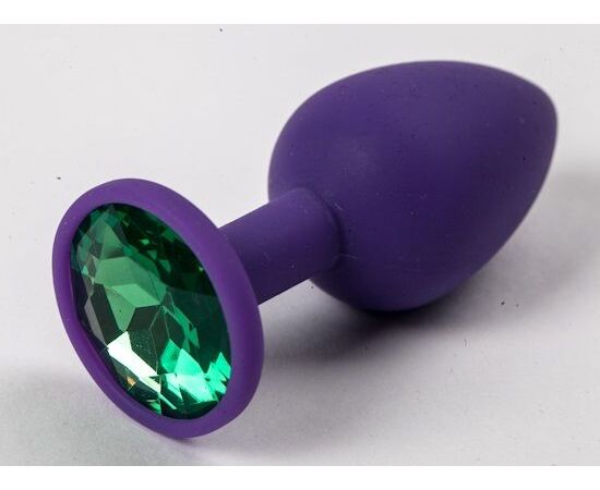Фиолетовая силиконовая анальная пробка с зеленым стразом - 7,1 см., фото 